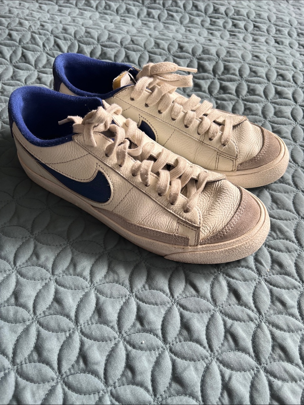 Nike Low-Top Sneakers in Cream with Blue Swoosh
